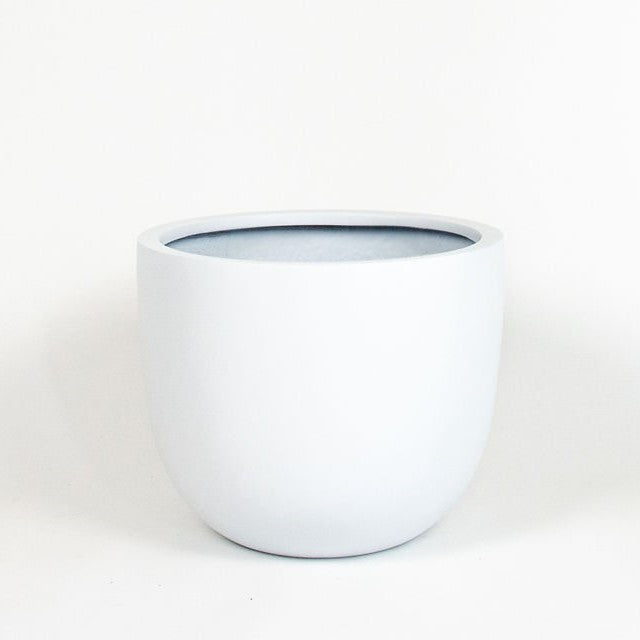 Matte white planter has volume and curve